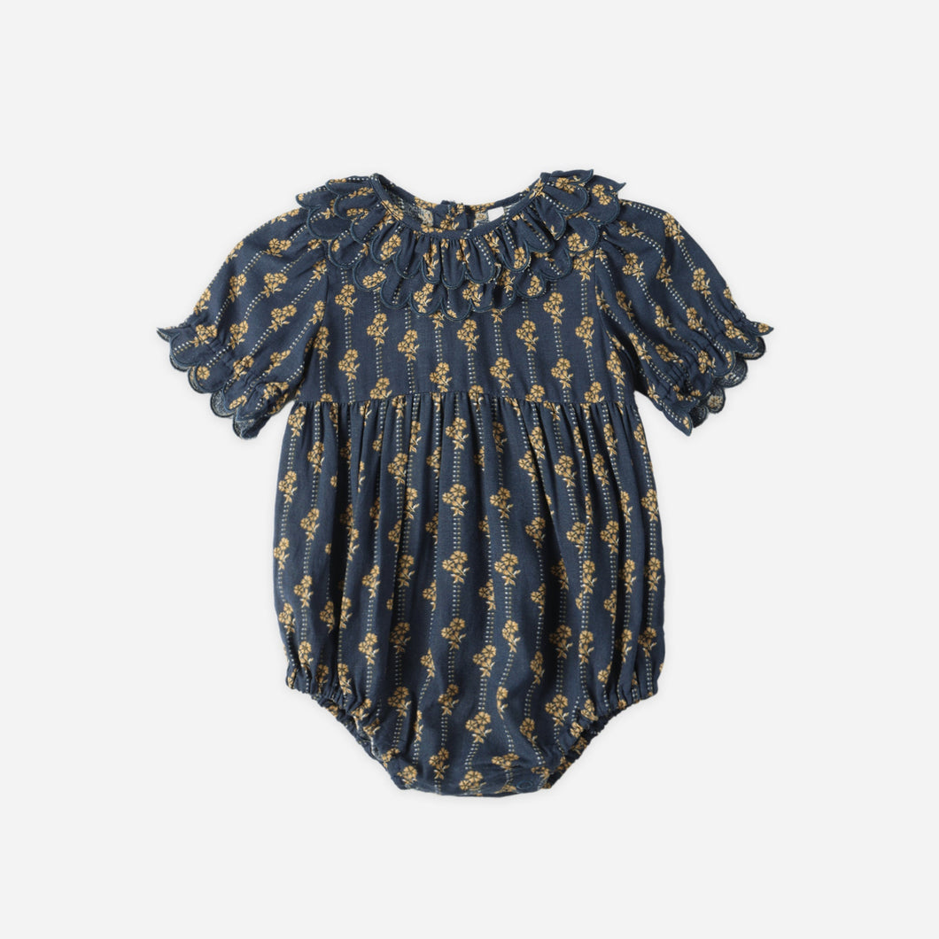 Blue baby romper with puff sleeves on a white background