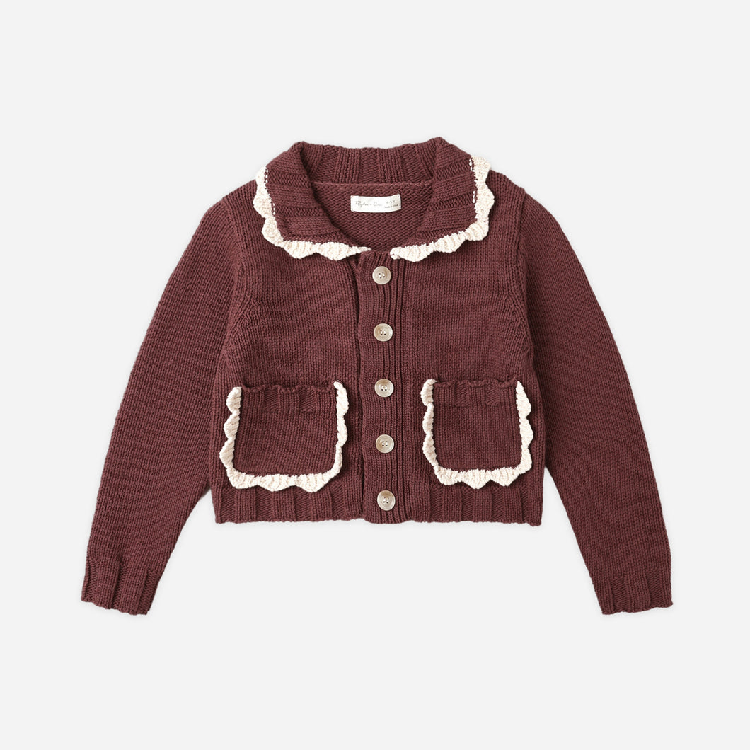 Brown cardigan with lace details on a white background