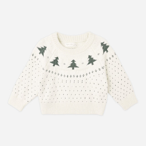 White sweater with green tree patterns on a white background
