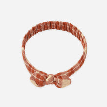 Load image into Gallery viewer, Rust-colored headband with a bow on a white background
