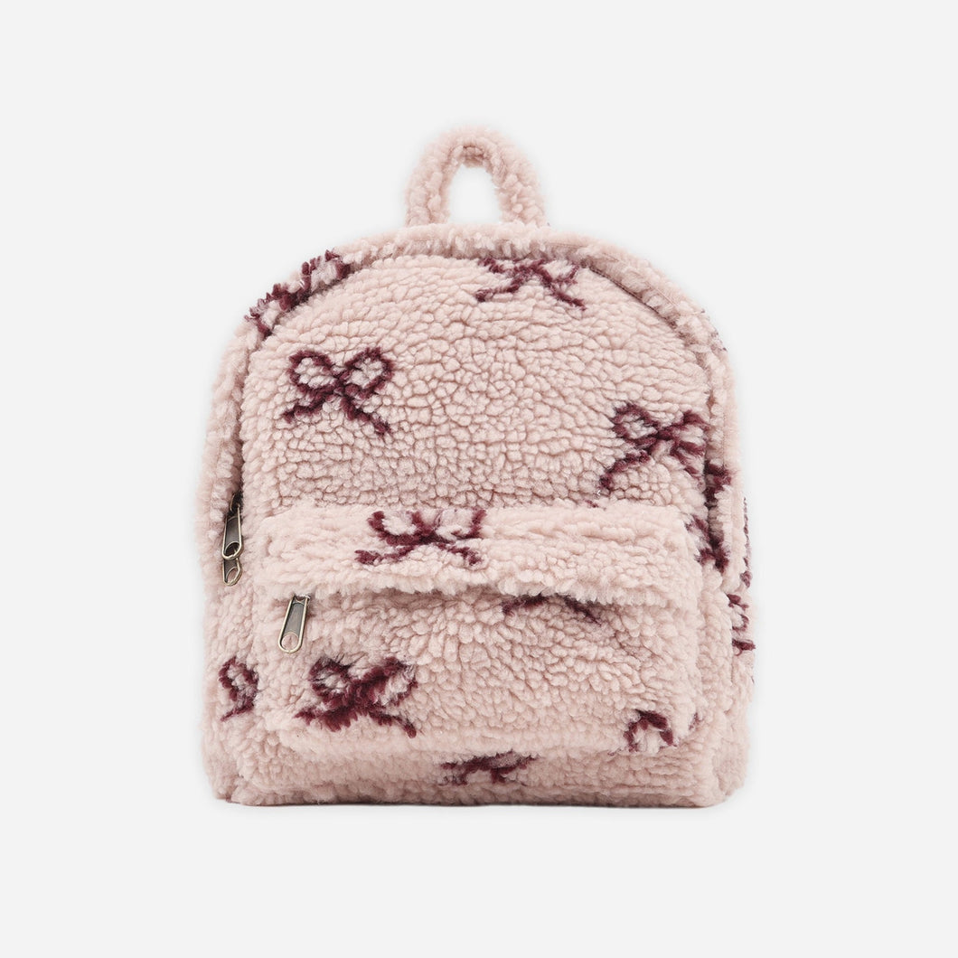 Small backpack with floral pattern on a white background