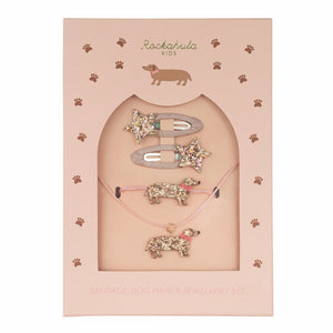Set of sausage dog-themed jewelry including a necklace, bracelet, and hair clip in packaging with 'Rockahula Kids' branding.