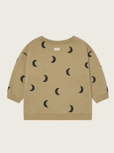 Beige sweatshirt with black moon pattern on a beige background