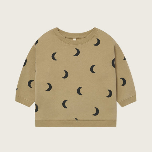 Beige sweatshirt with black moon pattern on a beige background