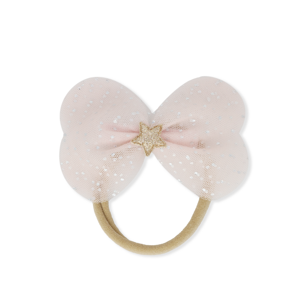 Pink bow-shaped hair accessory with a star detail on a white background