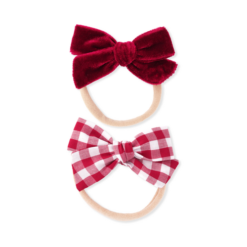 Two red and white checkered hair bows on white background