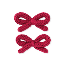 Load image into Gallery viewer, Two red knitted bows on a white background