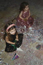 Load image into Gallery viewer, Konges Sløjd Tindra dress in mellow rose, soft pink girls’ dress shown in a styled outfit scene