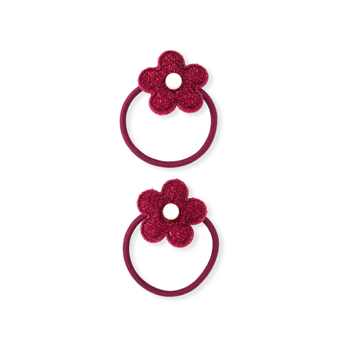 Two red floral hair ties on a white background