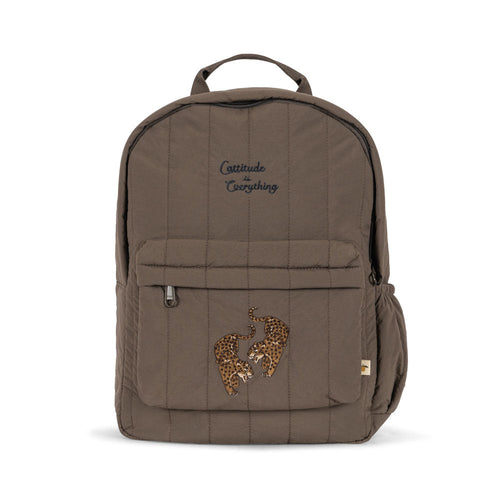 Brown backpack with embroidered design on a white background