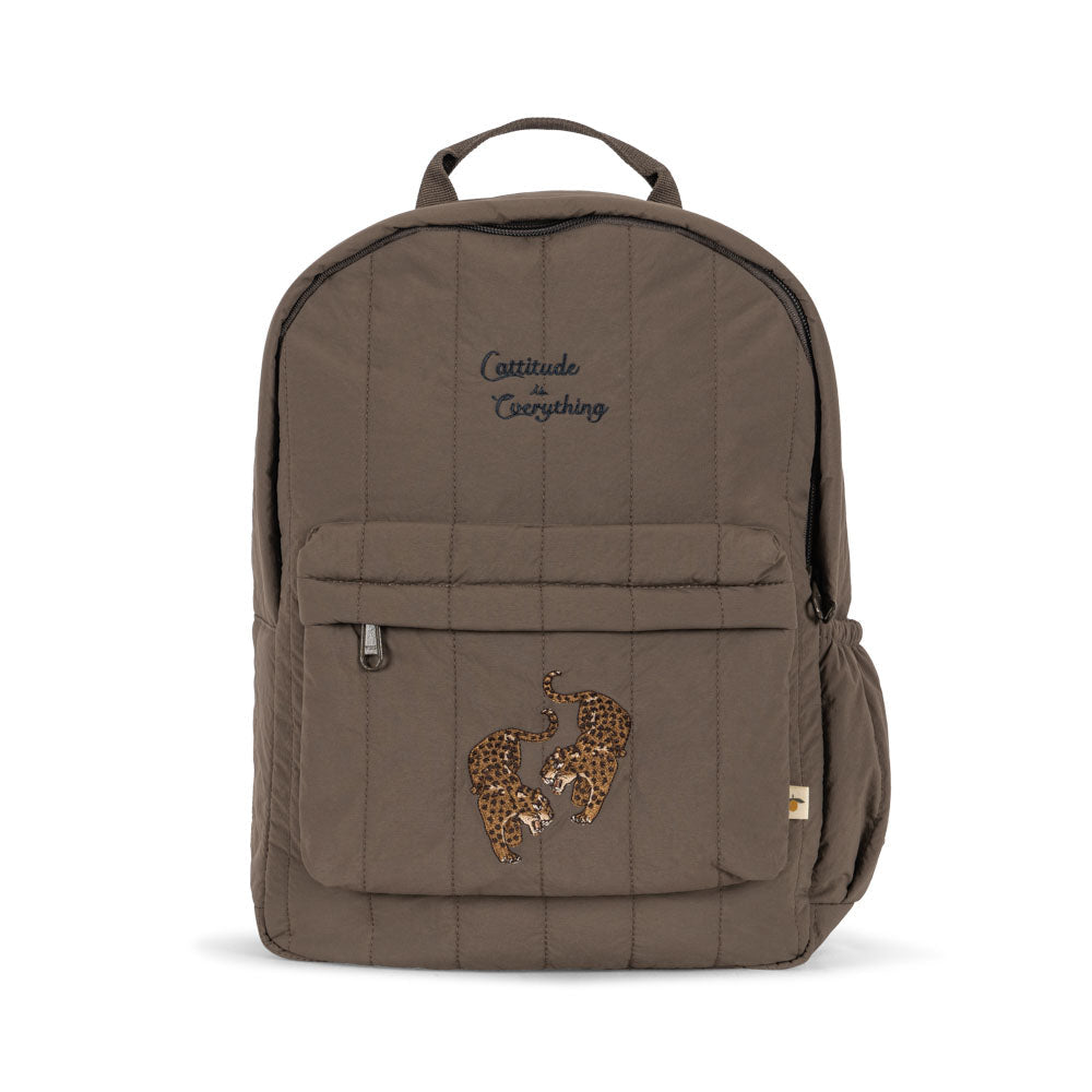 Brown backpack with embroidered design on a white background