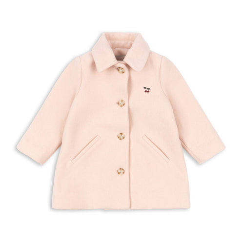 Pink coat with gold buttons on a white background