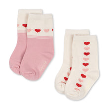 Load image into Gallery viewer, Pair of socks with heart patterns on a white background