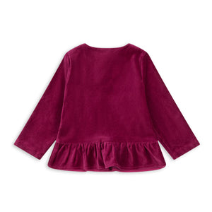 Purple long-sleeve top with ruffled hem on a white background