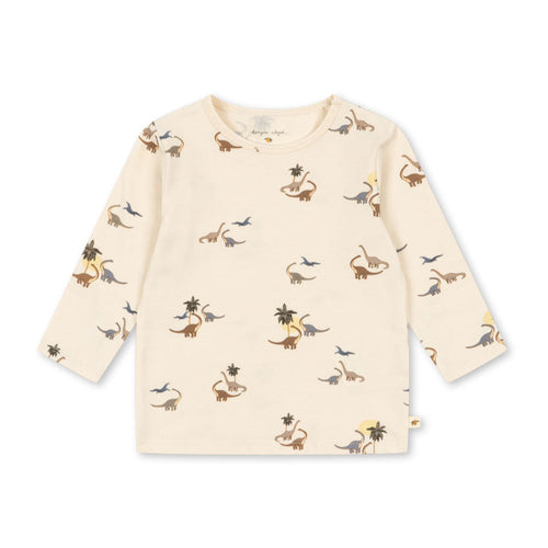 Beige long-sleeve shirt with dinosaur print on a white background