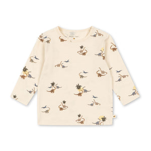 Beige long-sleeve shirt with dinosaur print on a white background