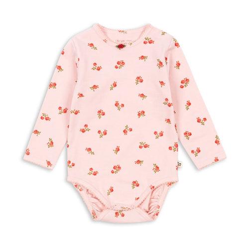 Pink baby bodysuit with floral pattern on a white background