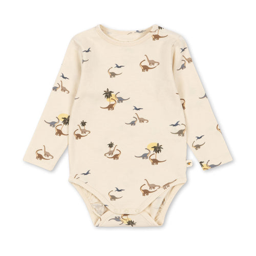 Baby onesie with dinosaur pattern on a white background