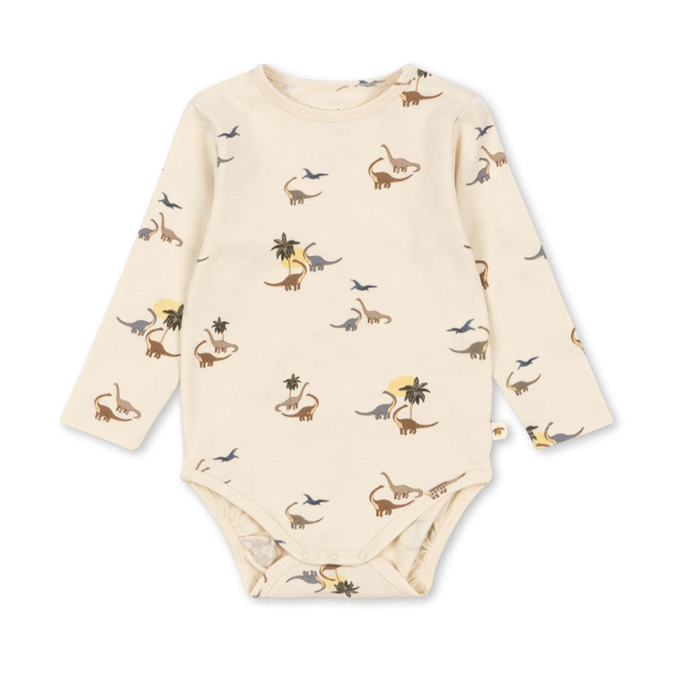 Baby onesie with dinosaur pattern on a white background