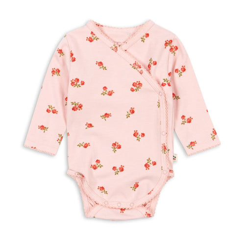 Pink baby bodysuit with floral pattern on a white background