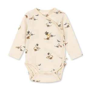 Baby onesie with dinosaur pattern on a white background