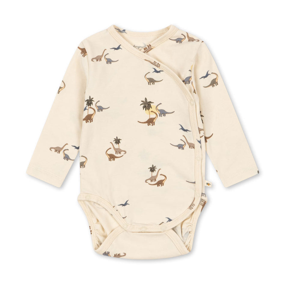 Baby onesie with dinosaur pattern on a white background