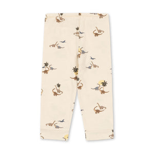 Beige pants with monkey and flower pattern on a white background
