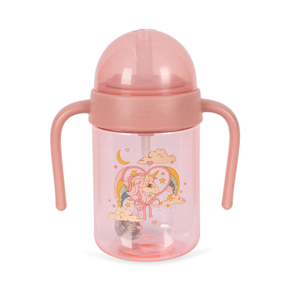 Pink sippy cup with cartoon design on a white background