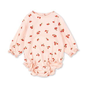 Pink baby romper with red floral pattern on a white background