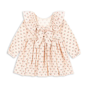 Pink floral dress with a bow on a white background