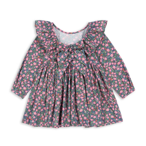 Floral dress with ruffled neckline on a white background