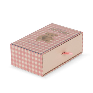 Pink checkered box with a teddy bear design on a white background