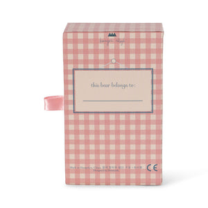 Pink checkered box with a label on a white background