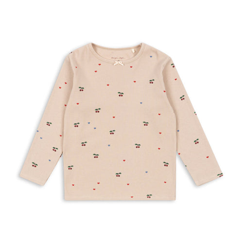 Beige long-sleeve shirt with small patterns on a white background