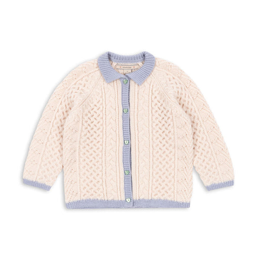 Knitted cardigan with blue trim on a white background