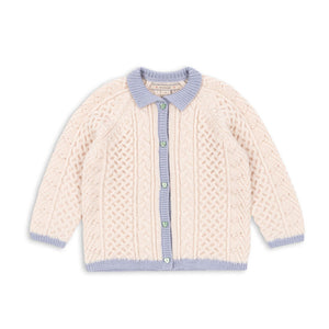 Knitted cardigan with blue trim on a white background