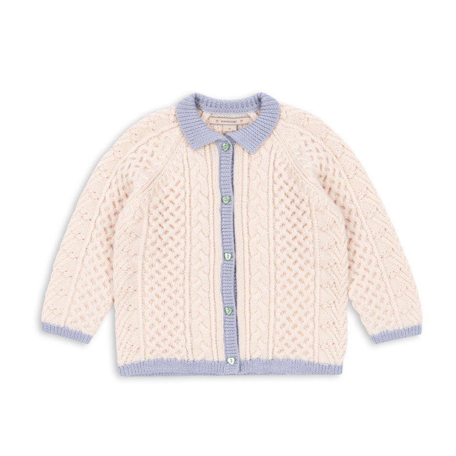 Knitted cardigan with blue trim on a white background