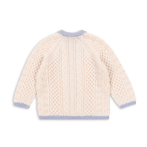Beige knitted cardigan with blue trim on a white background