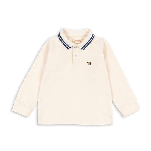 Cream-colored long-sleeve shirt with a small logo on a white background