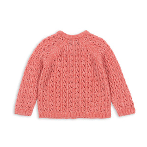 Pink knitted sweater on a white background