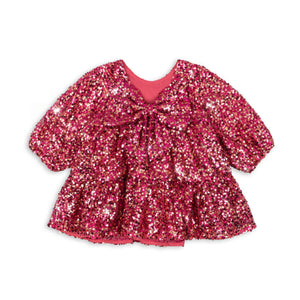 Pink sequin dress on a white background