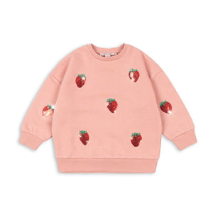 Pink sweatshirt with strawberry patterns on a white background