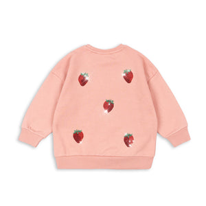Pink sweatshirt with strawberry patterns on a white background