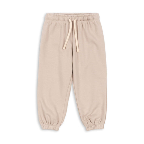 Beige sweatpants with a drawstring on a white background