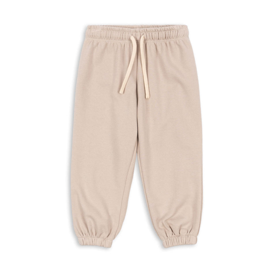 Beige sweatpants with a drawstring on a white background