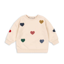將圖片載入圖庫檢視器 Beige sweatshirt with colorful heart patterns on a white background