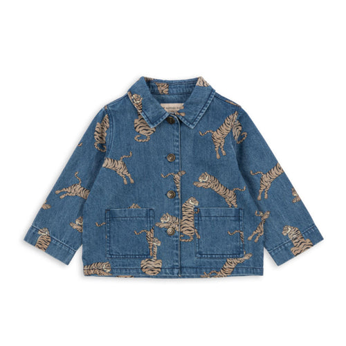 Blue denim jacket with gold animal prints on a white background