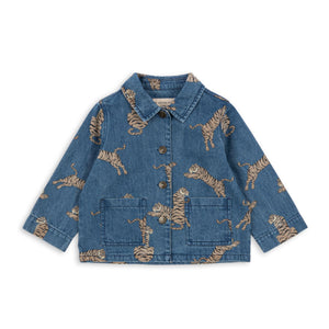 Blue denim jacket with gold animal prints on a white background