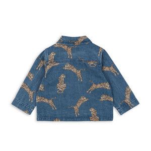 Blue denim jacket with gold animal prints on a white background