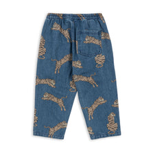 將圖片載入圖庫檢視器 Blue denim pants with gold tiger print on a white background